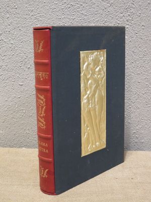 a book that is sitting on a table next to a wall