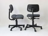 pair of black office chairs against a white backdrop