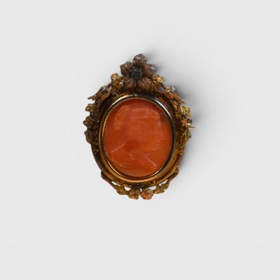 an image of a ring with a red stone in it