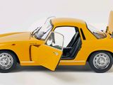 a yellow car with its door open on a white background