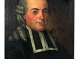 a portrait of a man in a black coat with a white collar