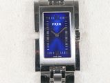 a wrist watch with a blue face on a silver bracelet