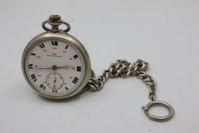 a silver pocket watch with roman numerals on it