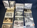 several old black and white photographs of buildings and buildings on a table