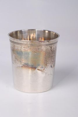 silver plated cup on a white surface with a white background