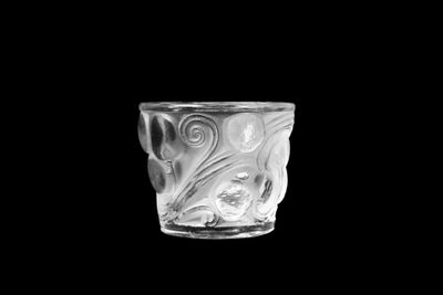 an image of a glass cup on a black background