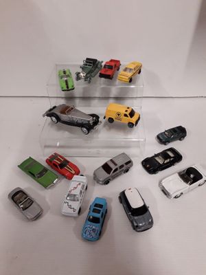 a lot of toy cars that are on the table