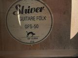 a sign that says shaver on the side of a building