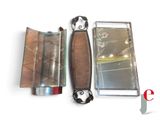 a small mirror and a lighter sitting next to each other