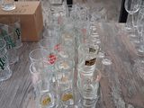 bottles and glasses on a table with a price tag on it