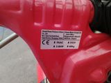a close up of a red gas can on a red motorcycle