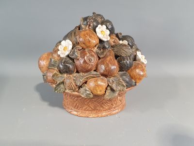 a vase with a bunch of nuts in it on a table