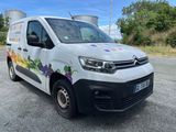 a white van that is parked on the side of the road