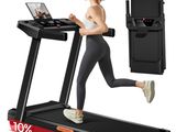 a woman running on a tread machine with a laptop