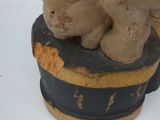 a figurine of two teddy bears sitting on top of a box