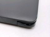 a close up of a laptop on a white surface