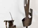 two pieces of art that are sitting on a table
