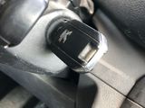 a close up of a car ' s dashboard with a remote control