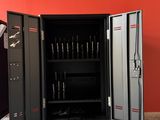 a metal cabinet with a bunch of tools inside of it