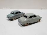 two toy cars that are sitting on a table