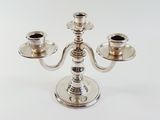 silver plated candelab with three candles on each side