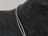a close up of a necklace on a mannequin mannequin mannequin mannequin mannequin mannequin mannequin mannequin