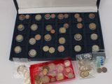 a box full of coins and a plastic container full of coins