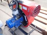 a red and blue machine that is sitting on a pallet