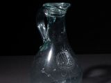 a glass vase that is sitting on a table