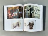 an open book with a picture of a man and a woman