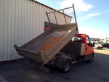 a dump truck that is parked in front of a building