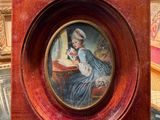 a picture of a woman in a blue dress in a wooden frame