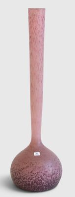 a pink vase that is sitting on a table