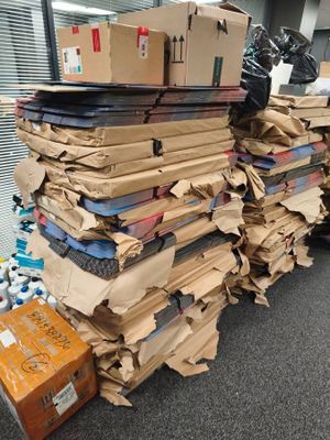 a large pile of boxes sitting on top of a pile of boxes