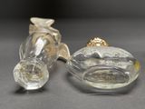 two glass figurines that are sitting next to each other