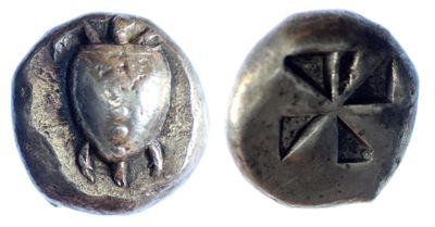 a close up of a silver coin with a bird on it