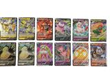 Plusieurs cartes Pokémon sont alignées sur une surface blanche