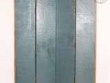 an image of a room divider with a wooden frame and blue paint