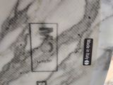 a picture of a marble table top with a picture on it