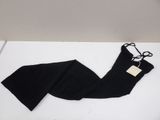 a pair of black leggings laying on top of a white table