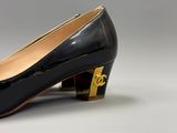chanel black patent pumps with gold hardware
