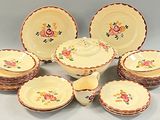 many plates and bowls that are sitting on a table