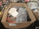 two boxes full of clothes sitting on the ground