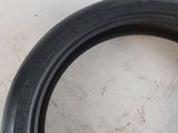 a close up of a tire tire on a white surface
