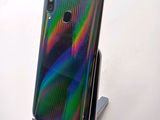 the back of a phone with a stand on top of it