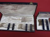 a box with silverware in it on a red surface