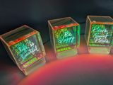three cubes that have been lit up with neon lights
