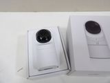 a white box with a camera inside of it