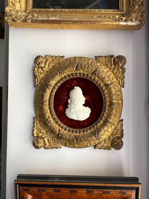 a gold frame with a picture of a man on it