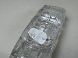 a clear cell phone sitting on top of a table